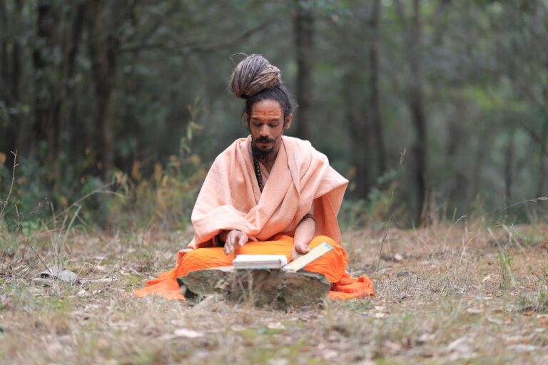 A person sitting in the middle of a forest