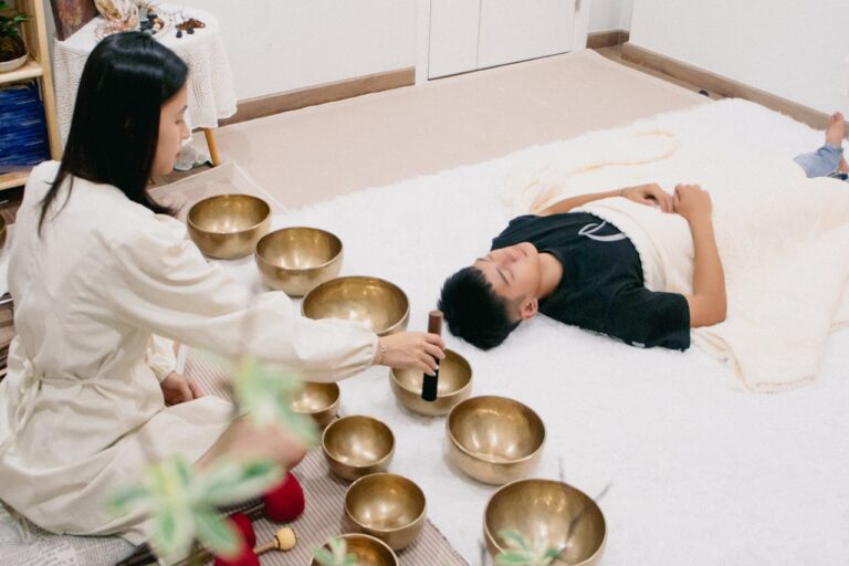 A couple of people that are laying on a bed