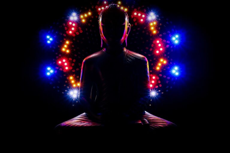 a man sitting in a lotus position with a lot of lights around him