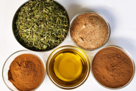 Four bowls filled with different types of spices