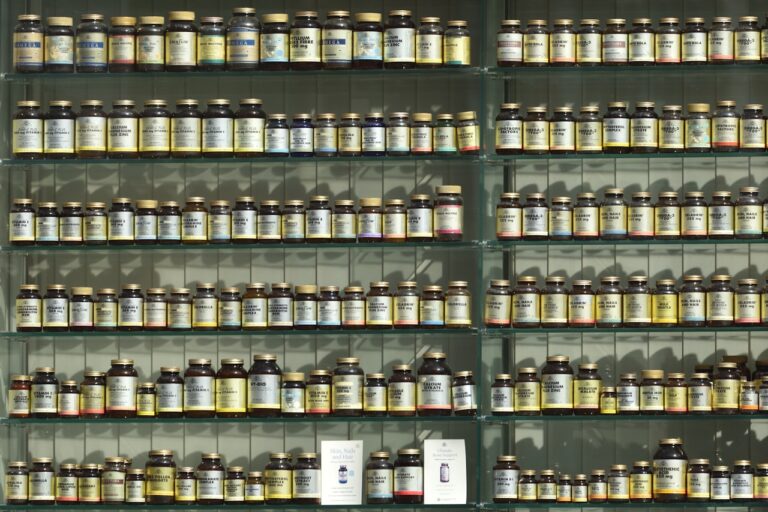 assorted labeled bottle on display shelf