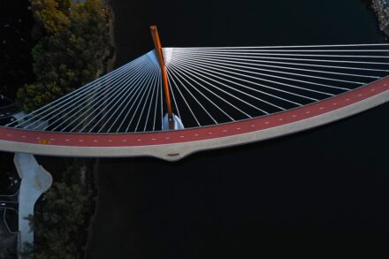 An aerial view of a bridge over a body of water