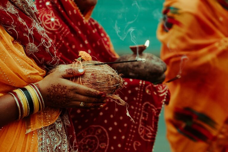 Traditional Healing Practices Woman holding coconut and incense during a religious ceremony