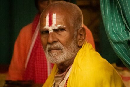 Traditional Healing Practices Elderly man with religious markings on forehead