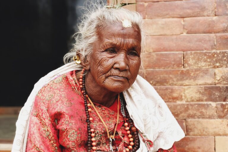 Traditional Healing Practices woman in red and white floral dress