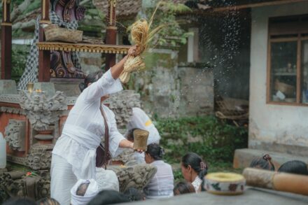 Traditional Healing Practices a group of people standing next to each other in front of a building