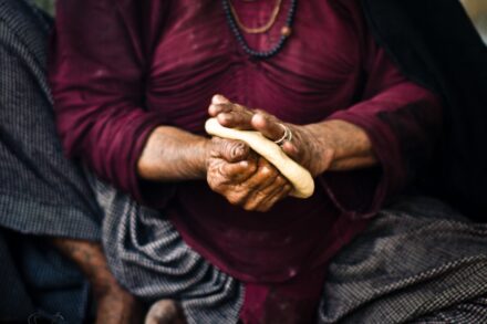 Traditional Healing Practices a woman holding a piece of bread in her hands