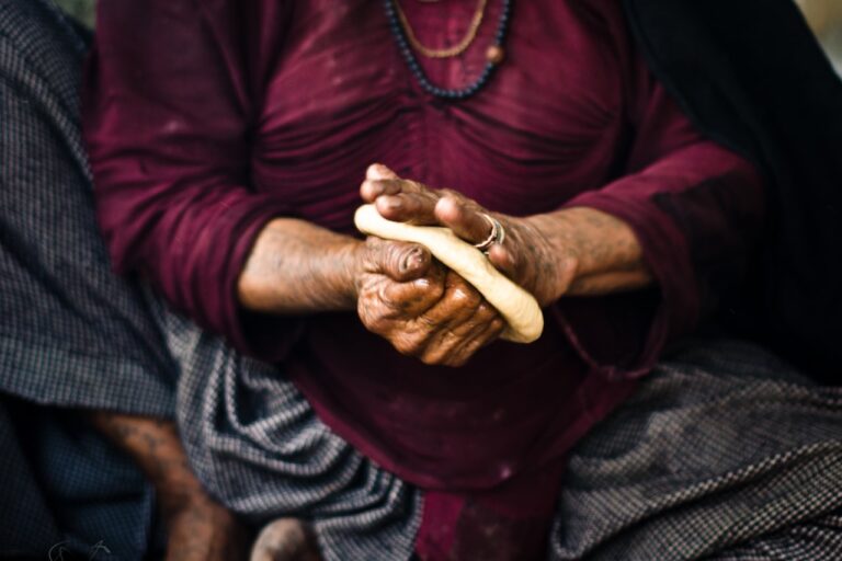 Traditional Healing Practices a woman holding a piece of bread in her hands