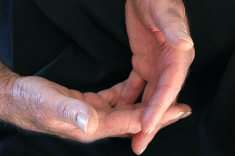 Energy Healing a close up of a person holding their hands together