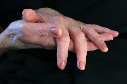 Energy Healing a close up of a person's hands holding another person's hand