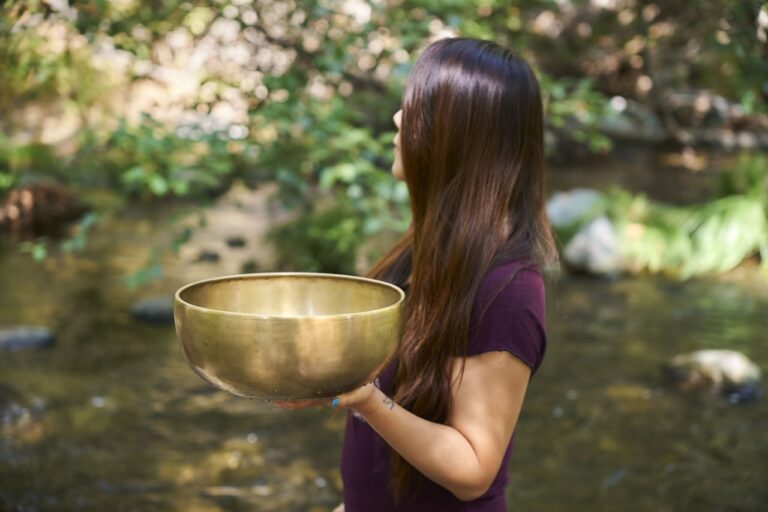 Energy Healing A woman holding a large bowl in her hands