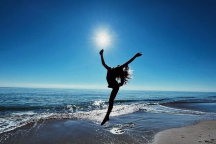 Why Energy Healing Works? 2 a person jumping on a beach